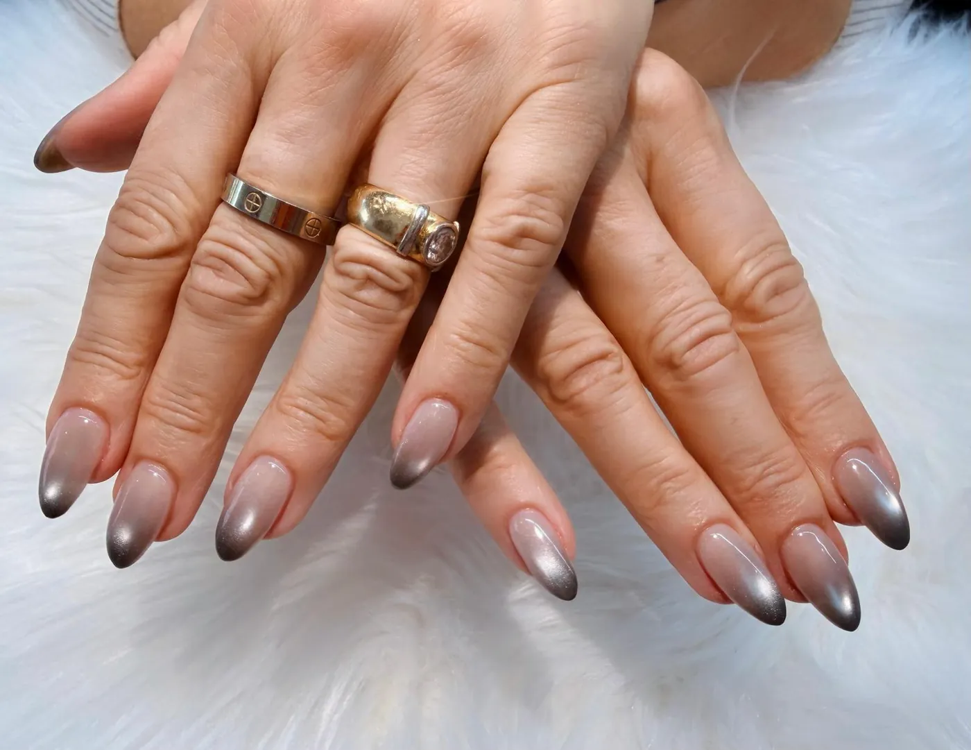 Almond nails with a smoky grey chrome ombré fade